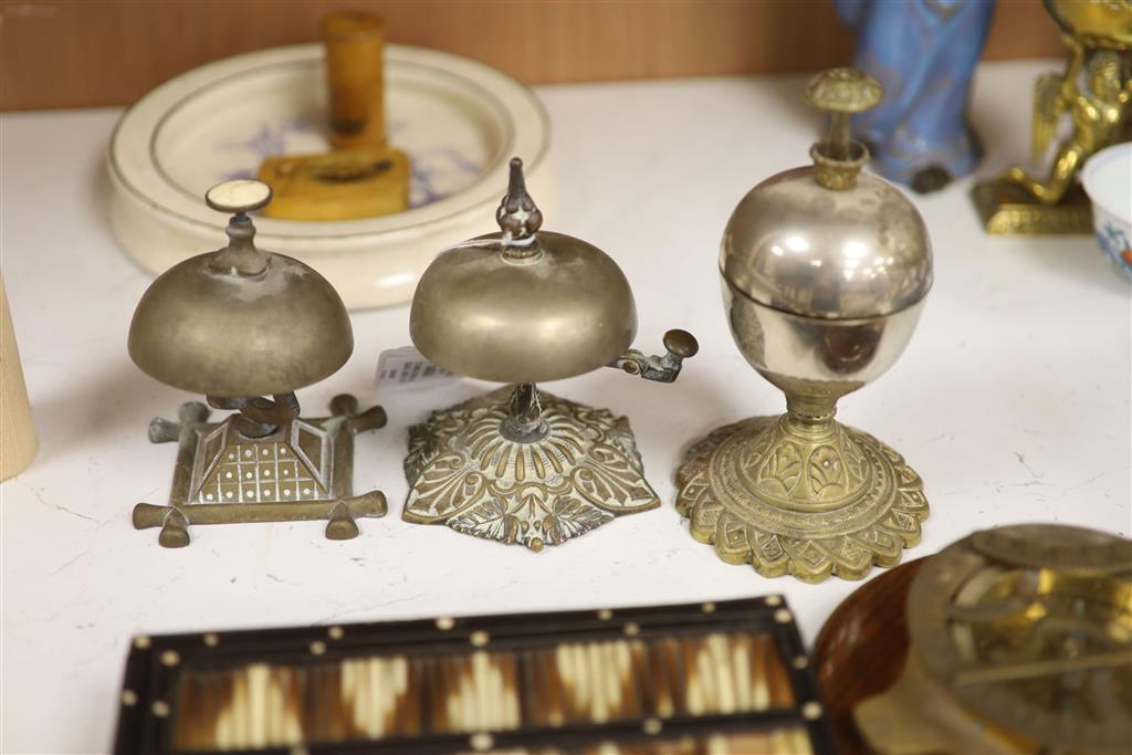 Three table bells, a porcupine quill box, a table compass and a Royal Doulton babys plate